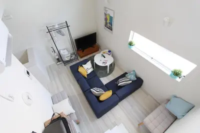 an overhead view of a living room with a blue couch at Shibuya Stay Tokyo B204 in Tokyo