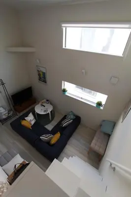 a living room with a couch and a table at Shibuya Stay Tokyo B204 in Tokyo