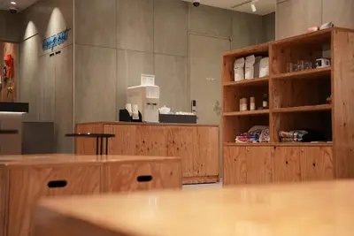 a restaurant with wooden counters and a coffee shop at Tokyu Stay Shibuya in Tokyo