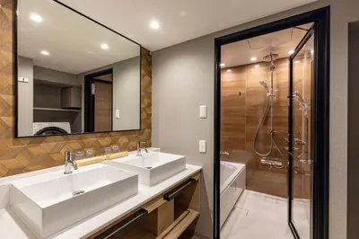 a bathroom with two sinks and a shower at Tokyu Stay Shibuya in Tokyo