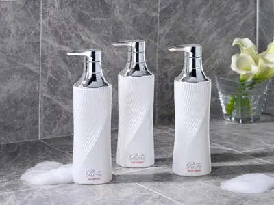 three bottles sitting on a counter in a bathroom at Tokyu Stay Shibuya in Tokyo