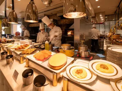 a group of chefs in a kitchen preparing food at Asakusa View Hotel in Tokyo