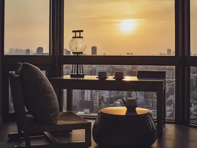 a room with a table and a chair and a window at Asakusa View Hotel in Tokyo