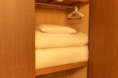 a couple of bunk beds in a small room at Garden Otsuka in Tokyo