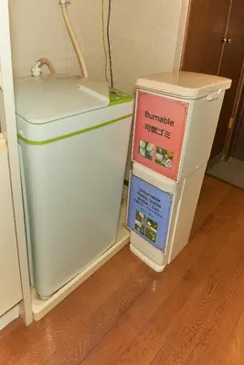a refrigerator with three boxes on top of it at Garden Otsuka in Tokyo