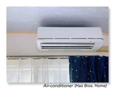 an air conditioner on a ceiling in a room at Hao Bros. Home in Tokyo