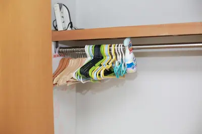 a closet with a bunch of folded towels on a shelf at Shinjuku Sunrise Apartment in Tokyo