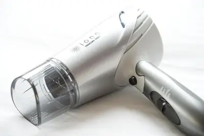 a silver appliance with a knife on a white background at Shinjuku Sunrise Apartment in Tokyo