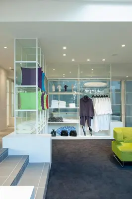 a dressing room with a display case with clothes at Agora Place Tokyo Asakusa in Tokyo