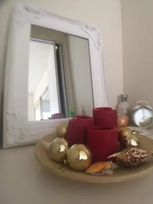a plate of christmas decorations in front of a mirror at COCO Nakameguro 201 in Tokyo