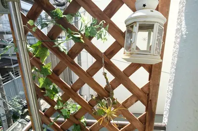 a wooden trellis with a light on it at COCO Nakameguro 201 in Tokyo