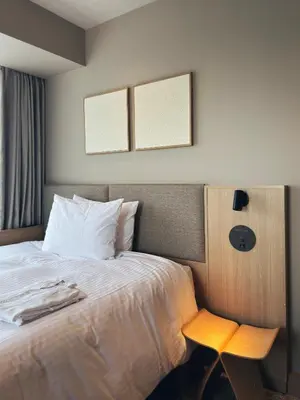 a hotel room with a bed with a table and a chair at Richmond Hotel Asakusa in Tokyo