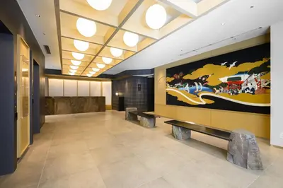 a lobby with a large painting on the wall at Richmond Hotel Asakusa in Tokyo