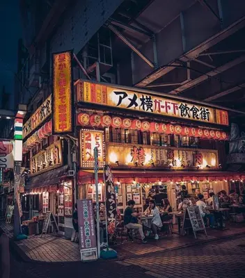 a group of people sitting in front of a restaurant at Alo BnB 1 - Near UENO, AKIHABARA, SENSOJI, TOKYO SKY TREE - Self check-in in Tokyo