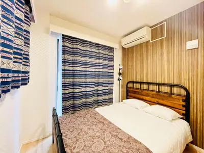 a bedroom with a bed and a window at Alo BnB 1 - Near UENO, AKIHABARA, SENSOJI, TOKYO SKY TREE - Self check-in in Tokyo
