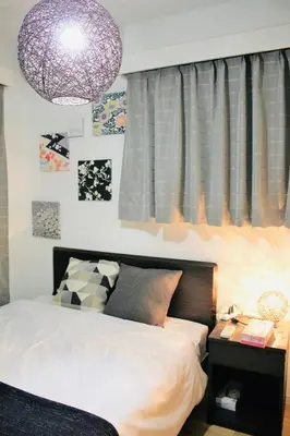 a bedroom with a bed and a purple chandelier at Alo BnB 1 - Near UENO, AKIHABARA, SENSOJI, TOKYO SKY TREE - Self check-in in Tokyo