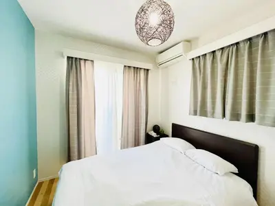 a bedroom with a white bed and a window at Alo BnB 1 - Near UENO, AKIHABARA, SENSOJI, TOKYO SKY TREE - Self check-in in Tokyo