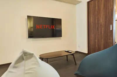 a living room with a tv and a table at Asakusa Eight -Tokyo Condominium Hotel- in Tokyo