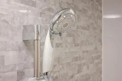 a shower with a blow dryer in a bathroom at Richmond Hotel Tokyo Mejiro in Tokyo