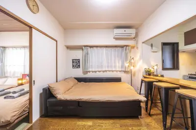 a small room with a bed and a kitchen at nestay apartment tokyo akihabara 2A in Tokyo