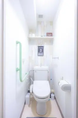 a bathroom with a toilet and a sign on the wall at nestay apartment tokyo akihabara 2A in Tokyo