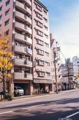 a tall building on the side of a city street at nestay apartment tokyo akihabara 2A in Tokyo