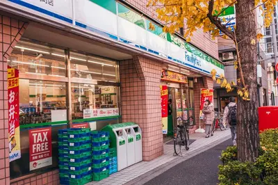 a store on a street with people walking in front of it at nestay apartment tokyo akihabara 2A in Tokyo