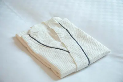 a white towel sitting on top of a table at Hotel Wing International Tokyo Akabane in Tokyo