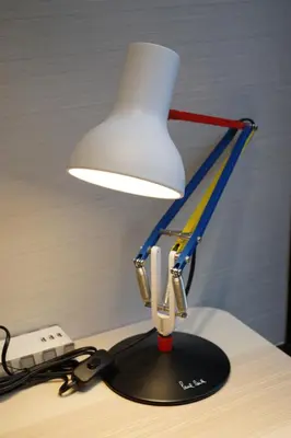 a desk lamp sitting on top of a desk at Real Life Kudanshita in Tokyo