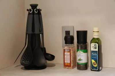 a black blender next to two bottles of sauce at Real Life Kudanshita in Tokyo