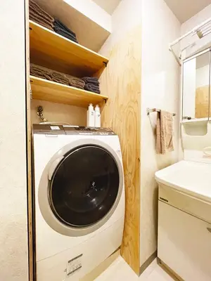 a washing machine in a bathroom next to a sink at Shibuya apartment SHINSEN in Tokyo