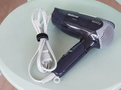 a hair dryer sitting on a white table at Chisun Inn Keikyu Kamata in Tokyo
