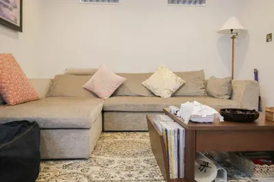 a living room with a couch and a table at Uhome Ikebukuro Villa 2 in Tokyo