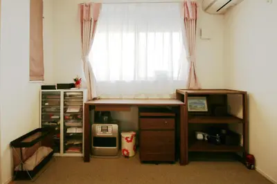 a room with a window with a desk at Uhome Ikebukuro Villa 2 in Tokyo