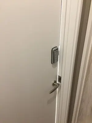 a white door with a door knob on it at Yushima Okachimachi Hotel in Tokyo