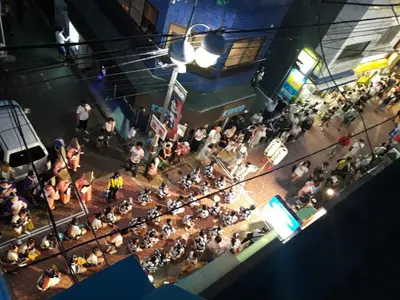 an overhead view of a crowd of people at a concert at TOP EDGE HOSTEL Koenji in Tokyo