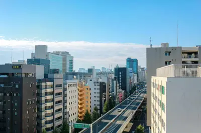 a view of a city with tall buildings at Hotel Comfact in Tokyo