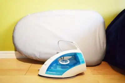 a iron sitting on the floor next to a mattress at LIONS APARTMENT 516 in Tokyo