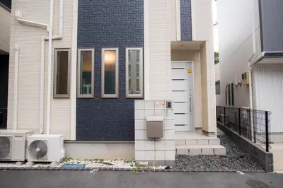 a house with a front door and a window at COCO Shinjuku HOTEL in Tokyo