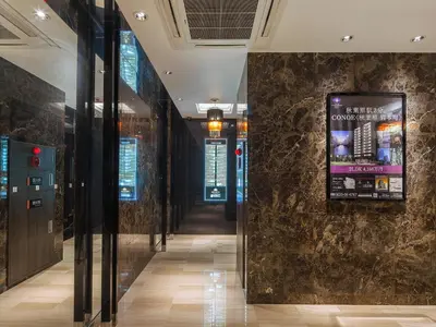 a hallway in a building with a sign on a wall at APA Hotel Akihabara Ekimae in Tokyo
