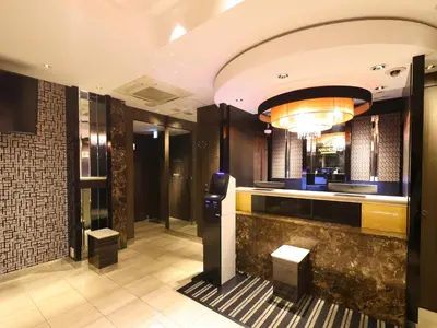 a lobby of a hotel with a parking meter at APA Hotel Akihabara Ekimae in Tokyo