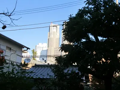 a view of a tall building in the distance at Studio Inn Nishi Shinjuku in Tokyo