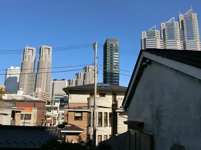 a view of a city skyline with tall buildings at Studio Inn Nishi Shinjuku in Tokyo