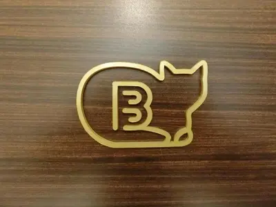a gold object with the number three on a table at Studio Inn Nishi Shinjuku in Tokyo
