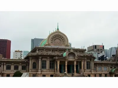 an old building in front of a city at KOKO HOTEL Shimbashi Onarimon - formerly Hotel Wing International Shimbashi Onarimon in Tokyo