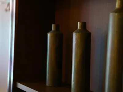 three brown vases sitting on top of a table at KOKO HOTEL Ikebukuro - formerly Hotel Wing International Select Ikebukuro in Tokyo