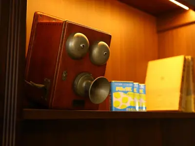 a wooden cabinet with knobs and a box on a shelf at KOKO HOTEL Ikebukuro - formerly Hotel Wing International Select Ikebukuro in Tokyo