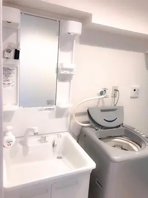 a bathroom with a toilet and a sink at Yoyogi Apartment 2-301 by Tranova in Tokyo