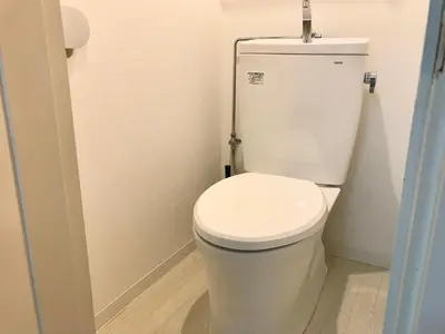 a bathroom with a white toilet in a room at Yoyogi Apartment 2-301 by Tranova in Tokyo
