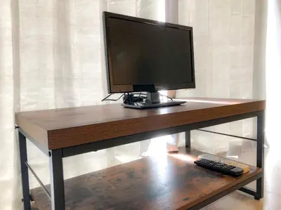 a computer monitor sitting on top of a desk at Yoyogi Apartment 2-301 by Tranova in Tokyo